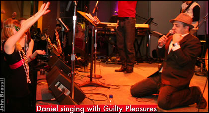 Daniel singing with Guilty Pleasures